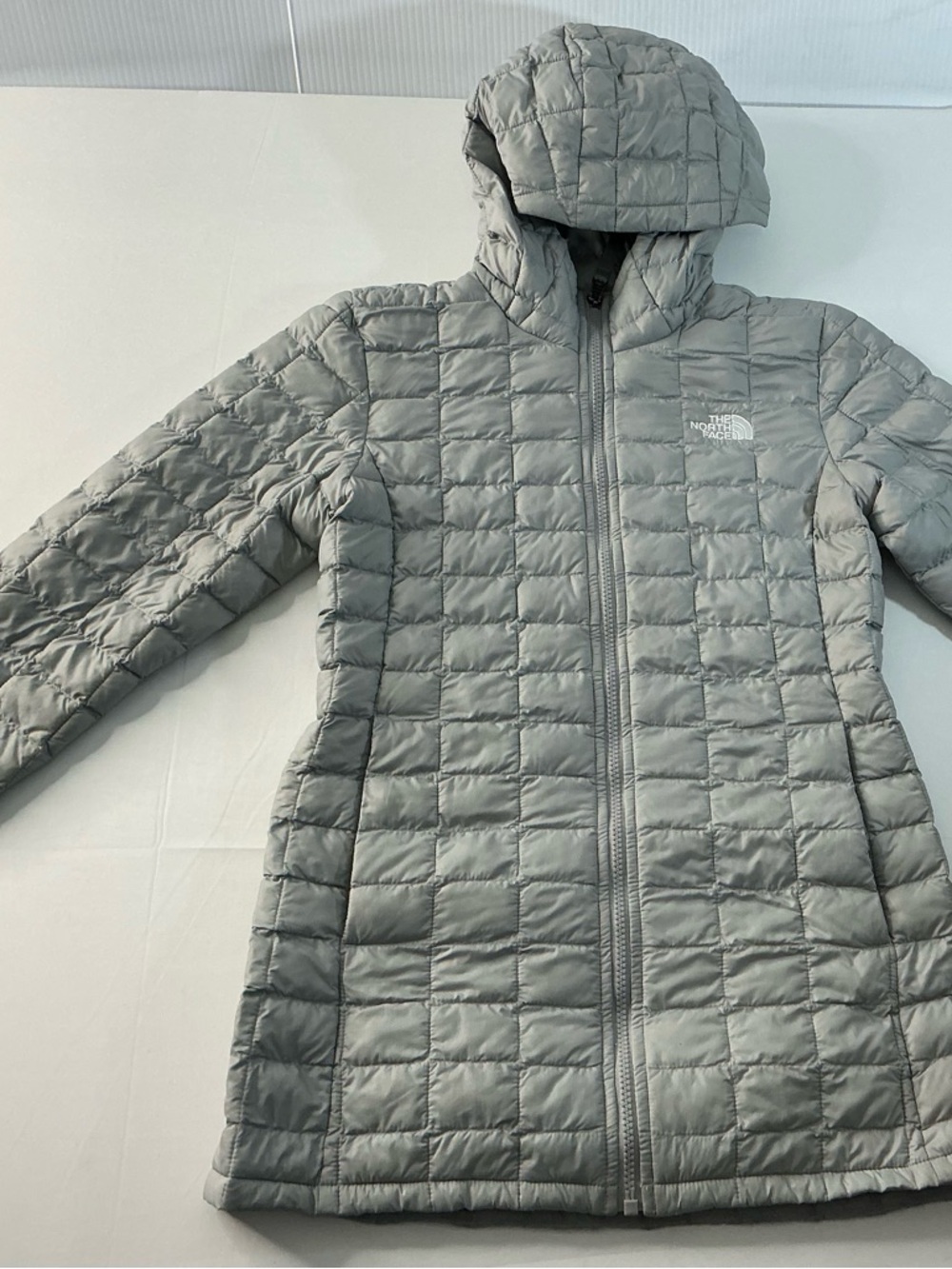 The North Face Quilted Jacket in Light Gray with White Logo